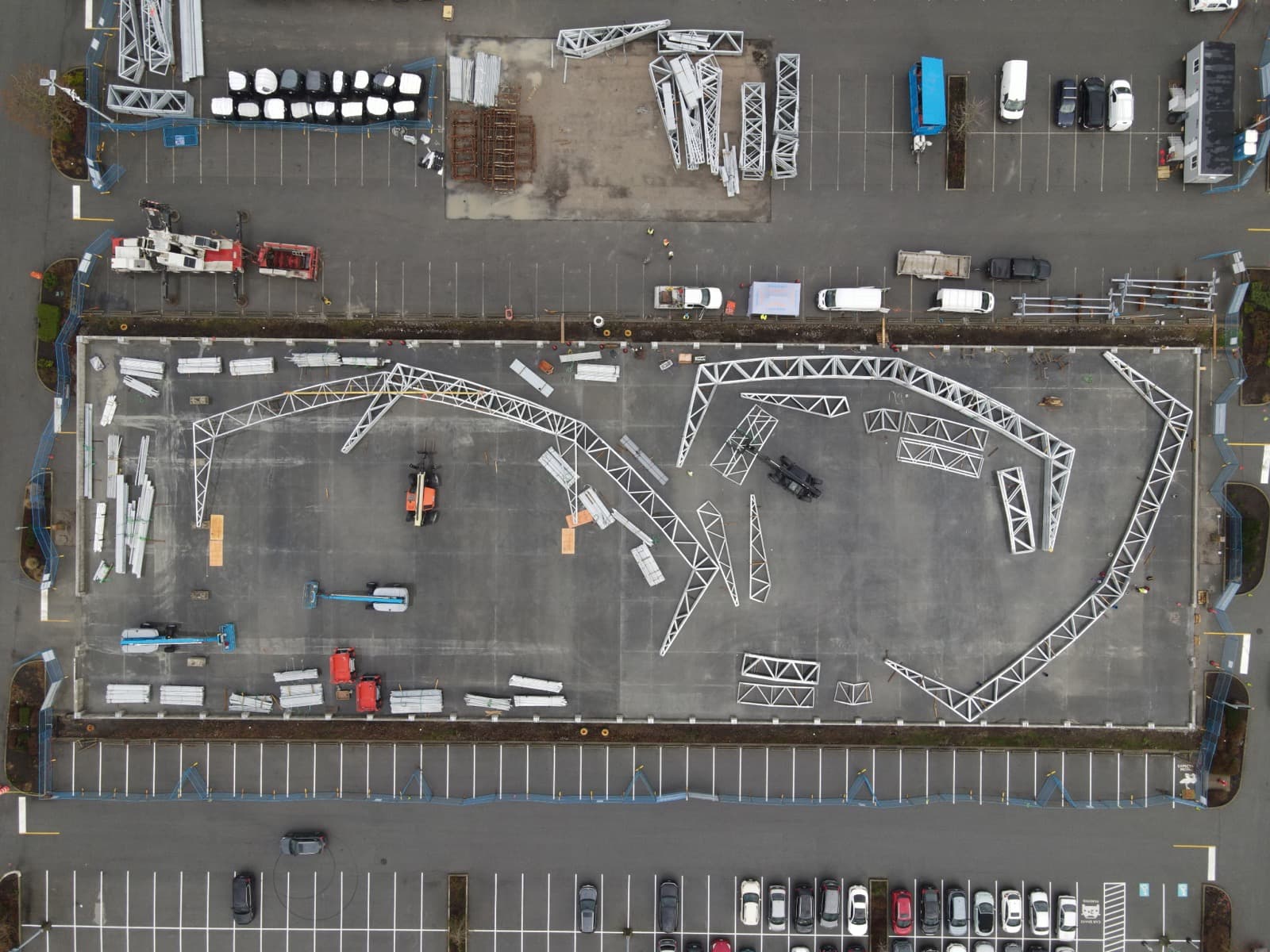 Steel structure components staged and fabricated in the yard.