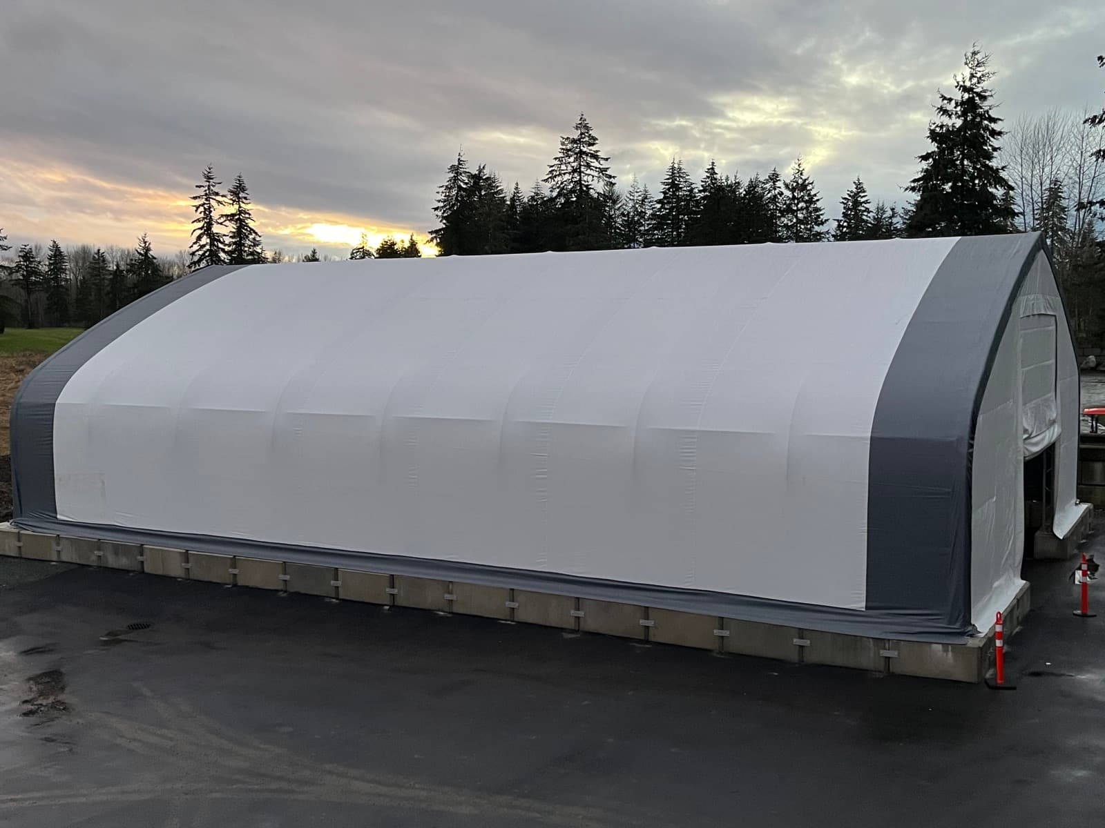 Container-mounted covered structure set up for storage and site access.
